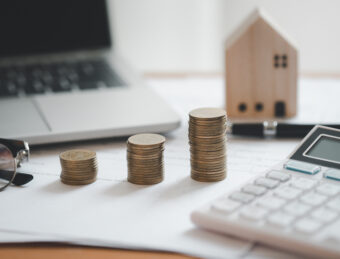Stacked of Coins ,Income Tax Raise Concept.